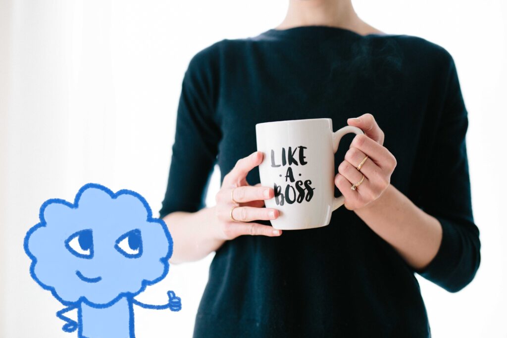 Woman holding a cup that say "Like a Boss"